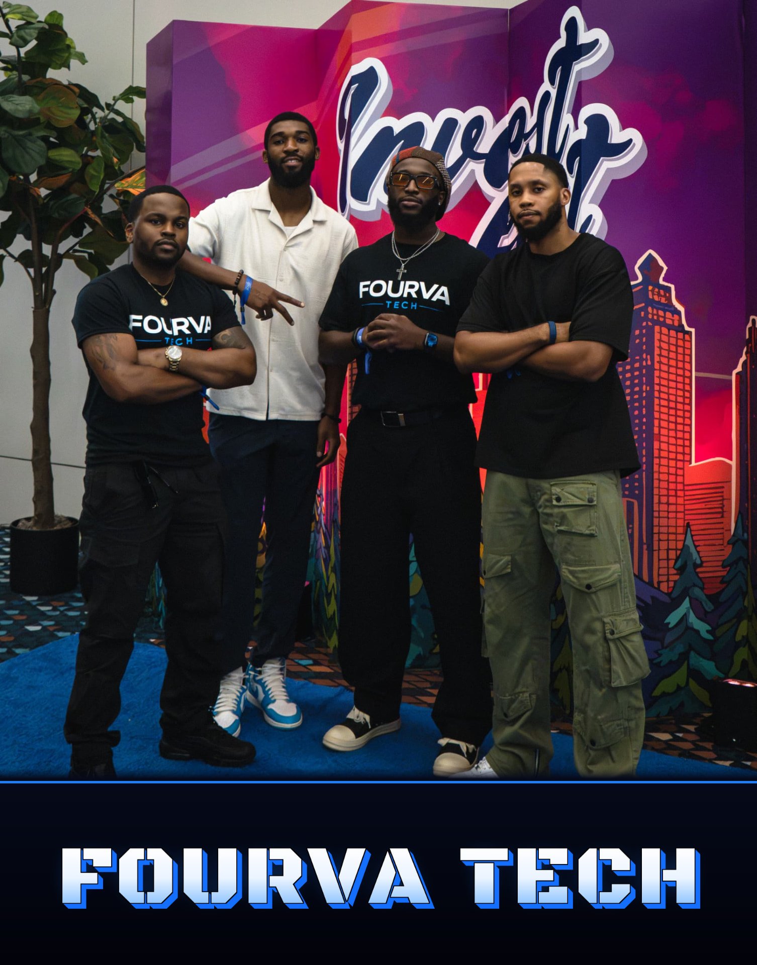Four men from Fourva Tech posing in front of the Invest Fest backdrop in Atlanta